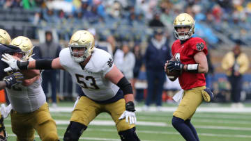 Notre Dame quarterback Sam Hartman (10) drops back to pass and is protected by offensive lineman