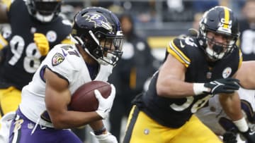 Dec 11, 2022; Pittsburgh, Pennsylvania, USA; Baltimore Ravens running back J.K. Dobbins (27) runs the ball against the Pittsburgh Steelers during the fourth quarter at Acrisure Stadium. Baltimore won 16-14. Mandatory Credit: Charles LeClaire-USA TODAY Sports