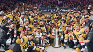LAS VEGAS, NEVADA - JUNE 13: Members of the Vegas Golden Knights pose with the Stanley Cup after defeating the Florida Panthers to win the championship in Game Five of the 2023 NHL Stanley Cup Final at T-Mobile Arena on June 13, 2023 in Las Vegas, Nevada. (Photo by Bruce Bennett/Getty Images)