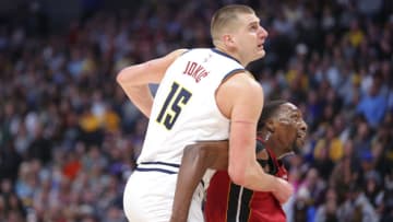 DENVER, CO - DECEMBER 30: Bam Adebayo #13 of the Miami Heat boxes out Nikola Jokic #15 of the Denver Nuggets during the third quarter at Ball Arena on December 30, 2022 in Denver, Colorado. NOTE TO USER: User expressly acknowledges and agrees that, by downloading and or using this photograph, user is consenting to the terms and conditions of Getty Images License Agreement. Mandatory Copyright Notice: Copyright 2022 NBAE (Photo by C. Morgan Engel/Getty Images)