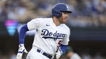 Freddie Freeman #5 of the Los Angeles Dodgers runs to first base for an rbi single against the Oakland Athletics during the first inning of a game at Dodger Stadium on August 02, 2023 in Los Angeles, California. (Photo by Michael Owens/Getty Images)