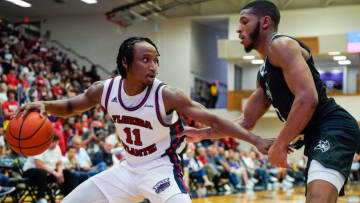 Feb 9, 2023; Boca Raton, Florida, USA; Florida Atlantic Owls guard Michael Forrest (11) fends of Rice Owls guard Travis Evee (3) during the second half at Eleanor R. Baldwin Arena. Mandatory Credit: Rich Storry-USA TODAY Sports