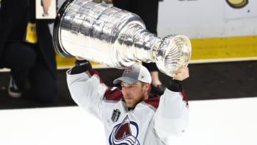 Jun 26, 2022; Tampa, Florida, USA; Colorado Avalanche goaltender Darcy Kuemper (35) celebrates with the Stanley Cup trophy after defeating the Tampa Bay Lightning during game six of the 2022 Stanley Cup Final at Amalie Arena. Mandatory Credit: Mark J. Rebilas-USA TODAY Sports