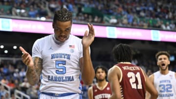 GREENSBORO, NORTH CAROLINA - MARCH 08: Armando Bacot #5 of the North Carolina Tar Heels reacts after drawing a foul against Devin McGlockton #21 of the Boston College Eagles during the first half of their game in the second round of the ACC Basketball Tournament at Greensboro Coliseum on March 08, 2023 in Greensboro, North Carolina. (Photo by Grant Halverson/Getty Images)