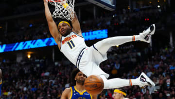 Denver Nuggets forward Bruce Brown finishes off a basket in the second half against the Golden State Warriors at Ball Arena. Mandatory Credit: Ron Chenoy-USA TODAY Sports