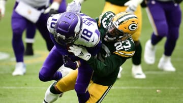 GREEN BAY, WISCONSIN - NOVEMBER 01: Justin Jefferson #18 of the Minnesota Vikings runs the ball as Jaire Alexander #23 of the Green Bay Packers defends during the second quarter of the game at Lambeau Field on November 01, 2020 in Green Bay, Wisconsin. (Photo by Stacy Revere/Getty Images)