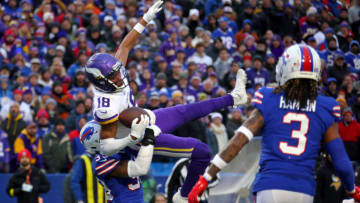 ORCHARD PARK, NEW YORK - NOVEMBER 13: Justin Jefferson #18 of the Minnesota Vikings catches a pass in front of Cam Lewis #39 of the Buffalo Bills during the fourth quarter at Highmark Stadium on November 13, 2022 in Orchard Park, New York. (Photo by Timothy T Ludwig/Getty Images)