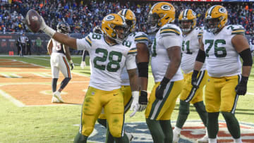 Dec 4, 2022; Chicago, Illinois, USA; Green Bay Packers running back AJ Dillon (28), celebrates after his touchdown against the Chicago Bears during the second half at Soldier Field. Mandatory Credit: Matt Marton-USA TODAY Sports