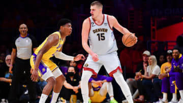 May 22, 2023; Los Angeles, California, USA; Denver Nuggets center Nikola Jokic (15) fights for position against Los Angeles Lakers forward Jarred Vanderbilt (2) during the third quarter in game four of the Western Conference Finals for the 2023 NBA playoffs at Crypto.com Arena. Mandatory Credit: Gary A. Vasquez-USA TODAY Sports