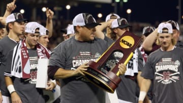 OMAHA, NEBRASKA - JUNE 30: Head coach Chris Lemonis of Mississippi St. celebrates with the Championship trophy after Mississippi St. beat Vanderbilt 9-0 during game three of the College World Series Championship at TD Ameritrade Park Omaha on June 30, 2021 in Omaha, Nebraska. (Photo by Sean M. Haffey/Getty Images)