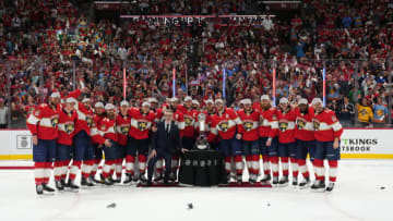 May 24, 2023; Sunrise, Florida, USA; Florida Panthers teammates pose for a photo with NHL senior executive vice president & chief branding officer Brian Jennings and the Prince of Wales trophy after defeating the Carolina Hurricanes in game four of the Eastern Conference Finals of the 2023 Stanley Cup Playoffs at FLA Live Arena. Mandatory Credit: Jasen Vinlove-USA TODAY Sports