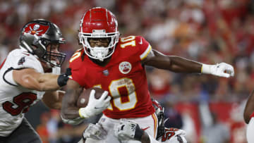Oct 2, 2022; Tampa, Florida, USA; Kansas City Chiefs running back Isiah Pacheco (10) runs with the ball as Tampa Bay Buccaneers linebacker Shaquil Barrett (58) defends during the first half at Raymond James Stadium. Mandatory Credit: Kim Klement-USA TODAY Sports