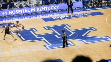 Kentucky-commit Reed Sheppard brings the ball up the court atop the large UK logo at the UK HealthCare Boys Sweet 16 tournament Wednesday at Rupp Arena. March 15, 20222022 Sweet Sixteen Boys Basketball Tournament