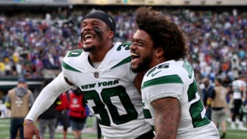 EAST RUTHERFORD, NEW JERSEY - NOVEMBER 06: Michael Carter II #30 of the New York Jets and Brandin Echols #26 of the New York Jets celebrate after beating the Buffalo Bills 20-17 at MetLife Stadium on November 06, 2022 in East Rutherford, New Jersey. (Photo by Elsa/Getty Images)